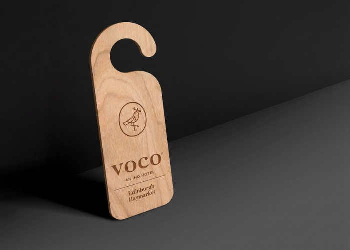Custom wooden hotel door hanger for Voco Edinburgh Haymarket, featuring the Voco logo and "AN IHG HOTEL